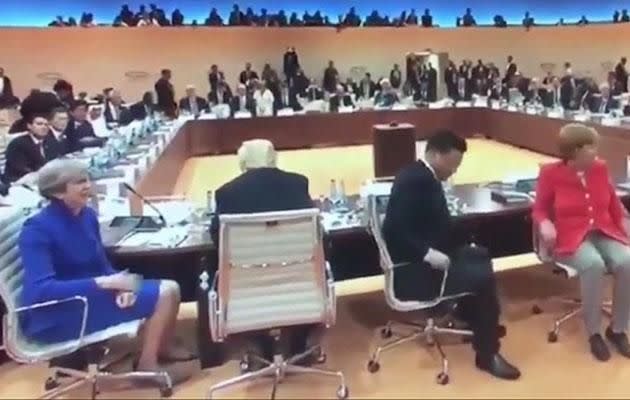 Trump was seen staring off ahead of him while Theresa May, Xi Jinping and Angela Merkel turned around for the cameras. Photo: The Mirror