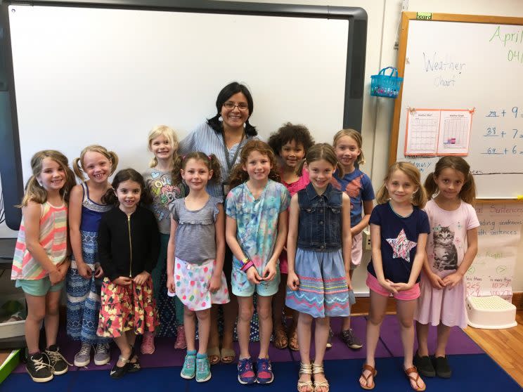 Leo Rose (front right, in pink shorts) poses with the fellow pigtailed girls of her first grade class and their teacher, Patricia Derrico, center. (Photo: Courtesy of Dana Fowle)