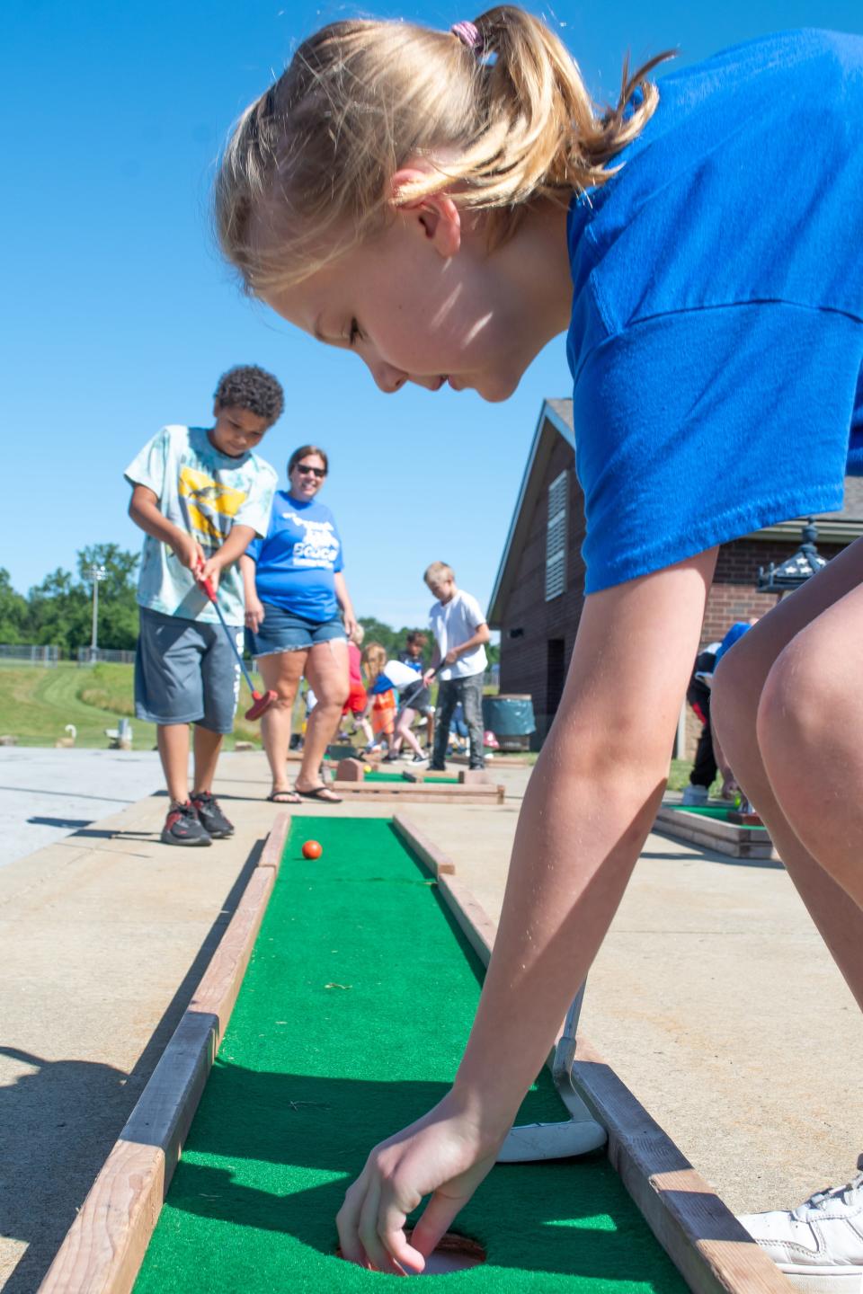 Students line up, trying to get a hole-in-one at the mini golf course set up at the intermediate school. The CATS Camp summer programming offers numerous activities, field trips, and hands-on educational opportunities.