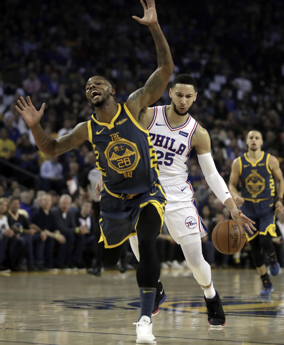 Philadelphia 76ers' Ben Simmons (25) drives the ball next to Golden State Warriors' Alfonzo McKinnie, left, during the first half of an NBA basketball game Thursday, Jan. 31, 2019, in Oakland, Calif. (AP Photo/Ben Margot)