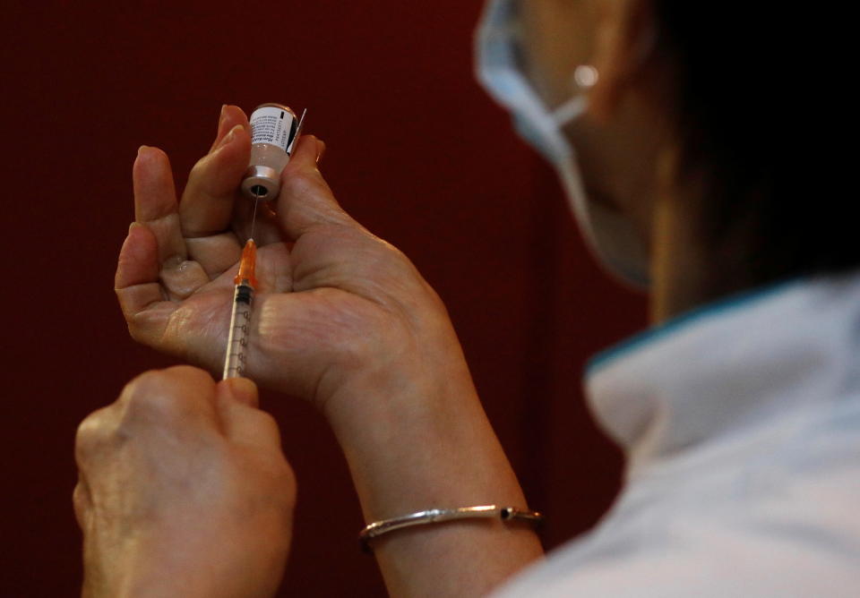 A nurse prepares to vaccinate healthcare workers at Gleneagles hospital in Singapore. 