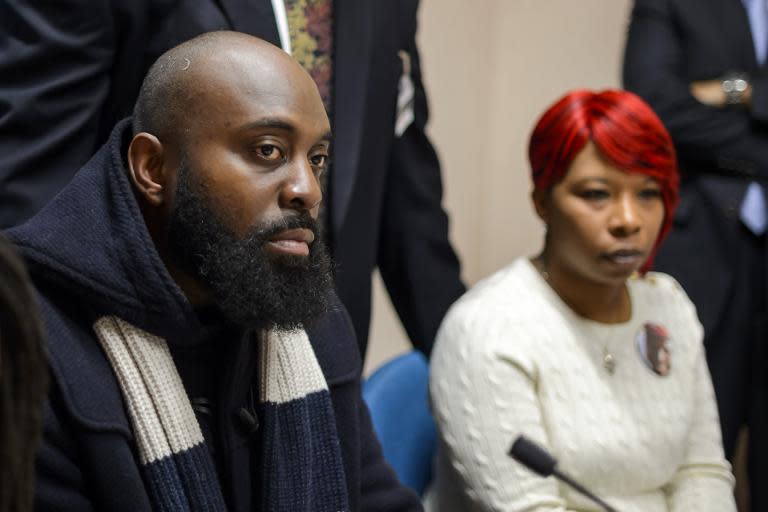 Michael Brown, Sr. and Lesley McSpadden (R), parents of unarmed black teenager Michael Brown who was shot and killed by a white police officer in Ferguson, at a press conference in Geneva on November 12, 2014