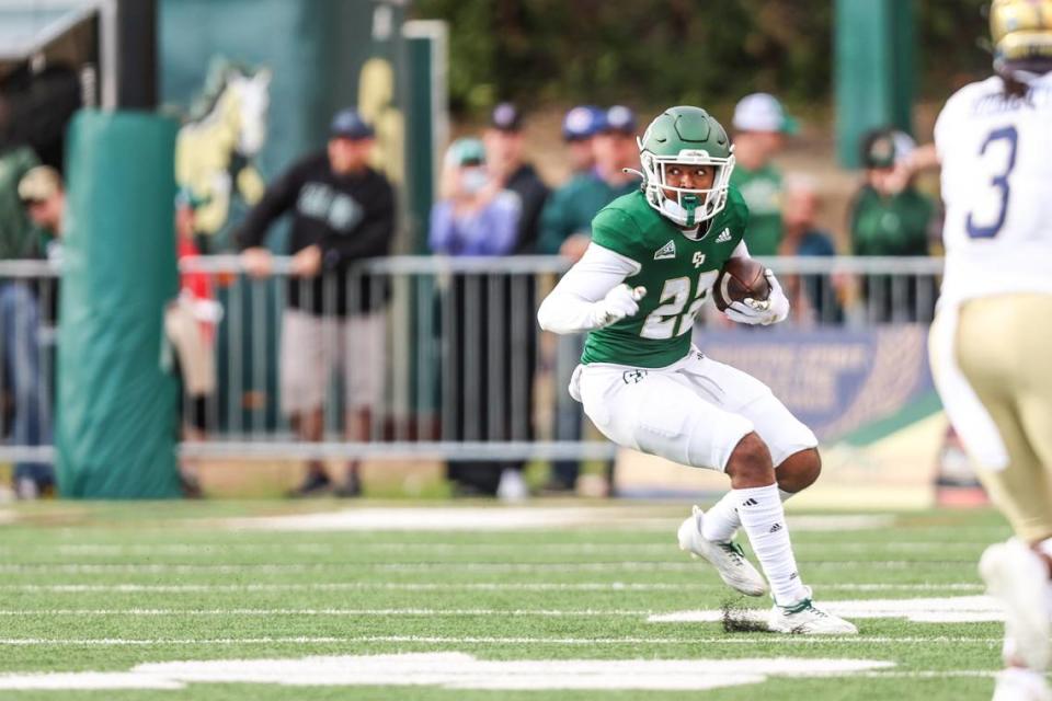 DUPLICATE***Cal Poly Mustangs running back Paul Holyfield Jr. (22) rushes the ball in the first half. Cal Poly Football hosted UC Davis. Photo by Owen Main