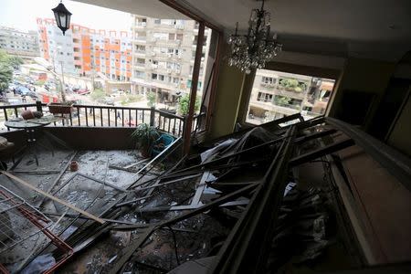 A nearby apartment damaged as a result of a car bomb attack on the convoy of Egyptian public prosecutor Hisham Barakat, near his house at Heliopolis district in Cairo, June 29, 2015. REUTERS/Mohamed Abd El Ghany