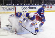 New York Rangers' Igor Shesterkin (31) and Zac Jones (6) defend against Buffalo Sabres' Tobias Rieder (13) during the second period of an NHL hockey game Tuesday, April 27, 2021, in New York. (Bruce Bennett/Pool Photo via AP)