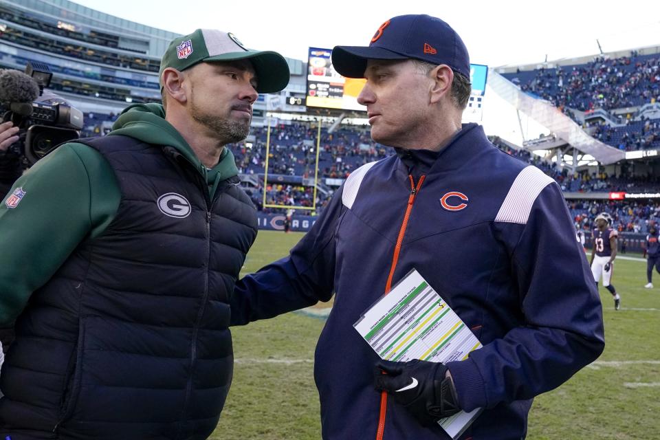 Chicago Bears head coach Matt Eberflus talks to Green Bay Packers head coach Matt LaFleur after an NFL football game Sunday, Dec. 4, 2022, in Chicago. The Packers won 28-19. (AP Photo/Nam Y. Huh)