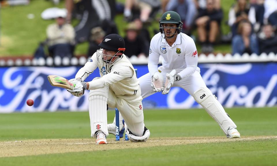 New Zealand's Henry Nicholls sweeps in front of South Africa's Quentin de Kock during the second cricket test at the Basin Reserve in Wellington, New Zealand, Saturday, March 18, 2017. (Ross Setford/SNPA via AP)