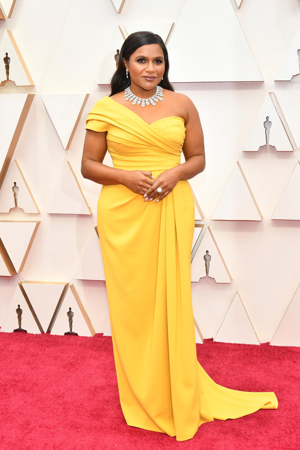 Kaling brought the glamour in a one-shoulder canary yellow Dolce & Gabbana gown. The "Late Night" writer and actress is set to take the stage as an Oscars presenter.