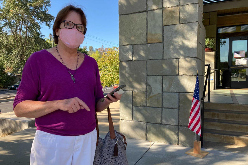 Janet Webb, 69, stands outside the Veterans Memorial Building after voting to recall California Gov. Gavin Newsom in Lafayette, Calif., on Tuesday, Sept. 14, 2021. Webb voted for Larry Elder because of Newsom's stance on vaccine mandates. "I am angry. It should be a freedom of choice, what is this a dictatorship? I've had it. I've never felt so angry. I'm losing all my friends and family, they don't want to have anything to do with me right now," she said. (AP Photo/Jocelyn Gecker)