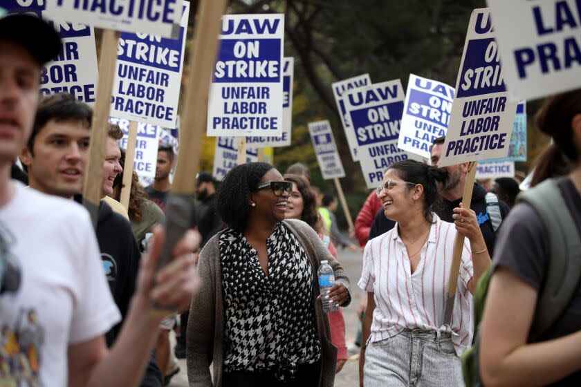 LOS ANGELES, CA - NOVEMBER 28: University of California academic workers strike walking the picket line on the Campus of the University of California, Los Angeles on Monday, Nov. 28, 2022 in Los Angeles, CA. As the nation's largest ever strike of higher-education academic workers enters its third week Monday, with the crunch time of final exams just days away, fears are rising over long-lasting and unintended consequences to the University of California's core missions of teaching and research. (Gary Coronado / Los Angeles Times)