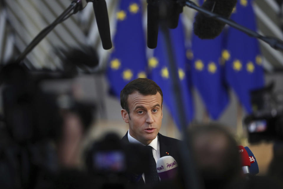 French President Emmanuel Macron arrives for an EU summit in Brussels, Thursday, Dec. 13, 2018. EU leaders gather Thursday for a two-day summit which will center on the Brexit negotiations. (AP Photo/Francisco Seco)