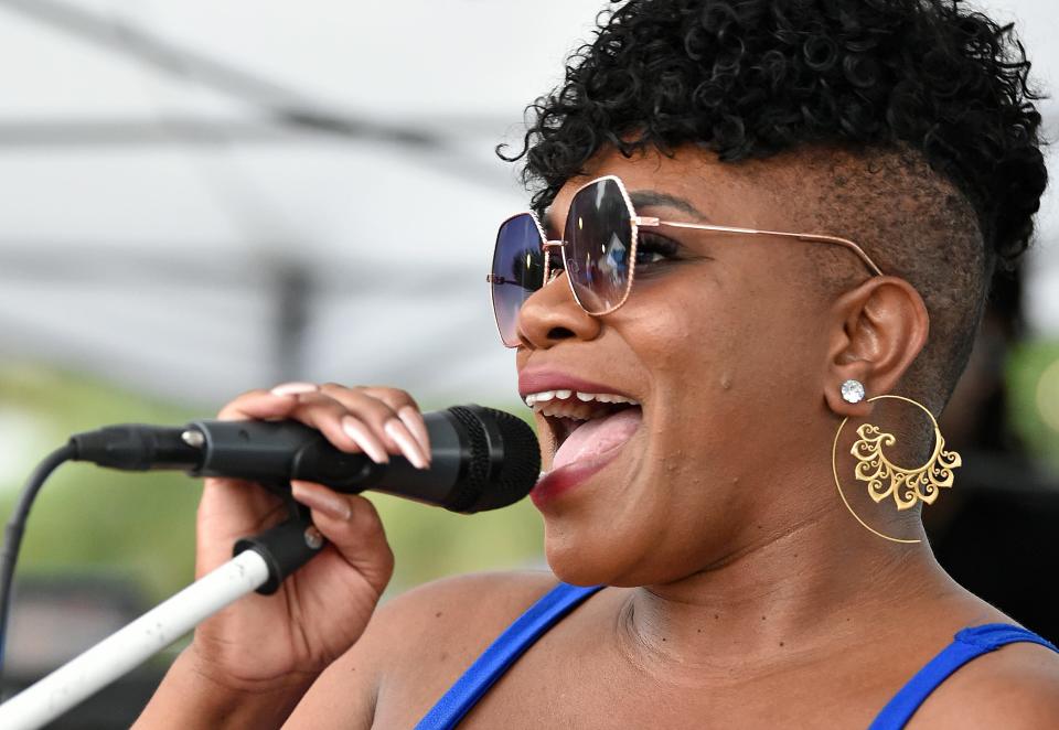 Reggae band Jah Movement with Shantel Norman on lead vocals during Newtown's 2022 Juneteenth Celebration.