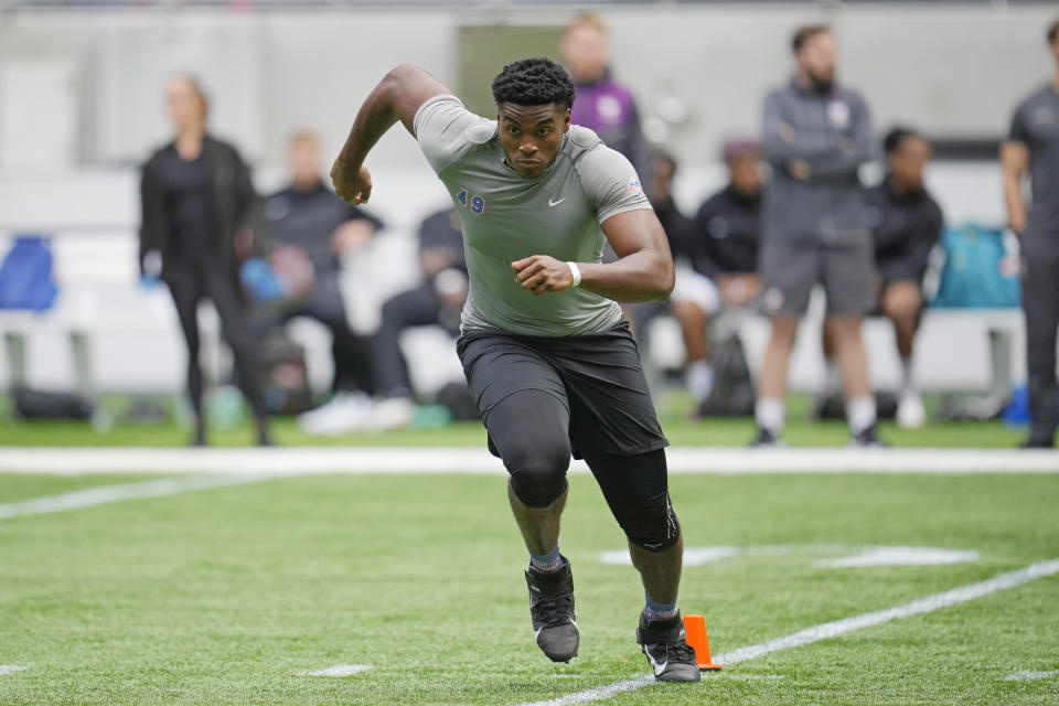 Offensive lineman Jason Godrick, of Nigeria, takes part in the NFL International Combine at the Tottenham Hotspur Stadium in London, Tuesday, Oct. 4, 2022. International athletes on Tuesday are taking part in a series of tests in front of NFL evaluators for a potential position in the NFL's International Player Pathway programme. (AP Photo/Kin Cheung)