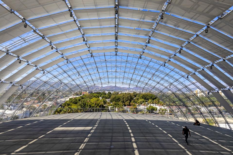 An arching roof over a deck overlooking Hollywood