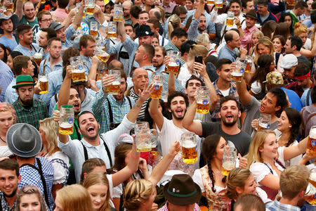 Visitors cheer with beer during the opening day of the 183rd Oktoberfest in Munich, Germany, September 17, 2016. REUTERS/Michaela Rehle/File Photo