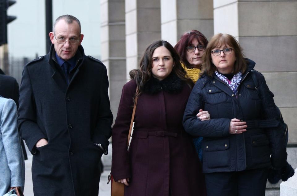 Charlotte Brown’s father Graham Brown (left), with her twin sister Katie Brown (second left) and her mother Roz Wickens (right) (Yui Mok/PA)