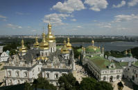 FILE - In this Sunday, July 27, 2008 file photo, The thousand-year-old Monastery of Caves, the holiest site of Eastern Orthodox Christians, against the background of the Dnipro River, in Kiev, Ukraine. Tensions over the imminent formation of a Ukrainian Orthodox church independent of Moscow are raising fears that nationalists may try to seize Russian church properties. (AP Photo/Efrem Lukatsky, FILE)