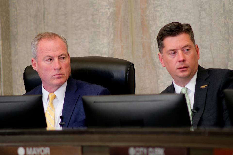 City Manager Craig Freeman, left, and Mayor David Holt attend a meeting Tuesday where Oklahoma City councilmembers approved sending the new NBA arena proposal to the Dec. 12 ballot for voters to decide.