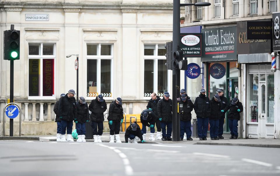 Police officers conduct a search on Streatham High Road in south London on February 3, 2020, after a man was shot dead by police on February 2, following reports he had stabbed two people. - British police were searching two homes on Monday after shooting dead a convicted terrorist who knifed two people in a London street. Sudesh Amman, 20, who was wearing a fake suicide vest, was shot on a busy road in south London on Sunday after what police said was an "Islamist-related" incident. (Photo by DANIEL LEAL-OLIVAS / AFP) (Photo by DANIEL LEAL-OLIVAS/AFP via Getty Images)