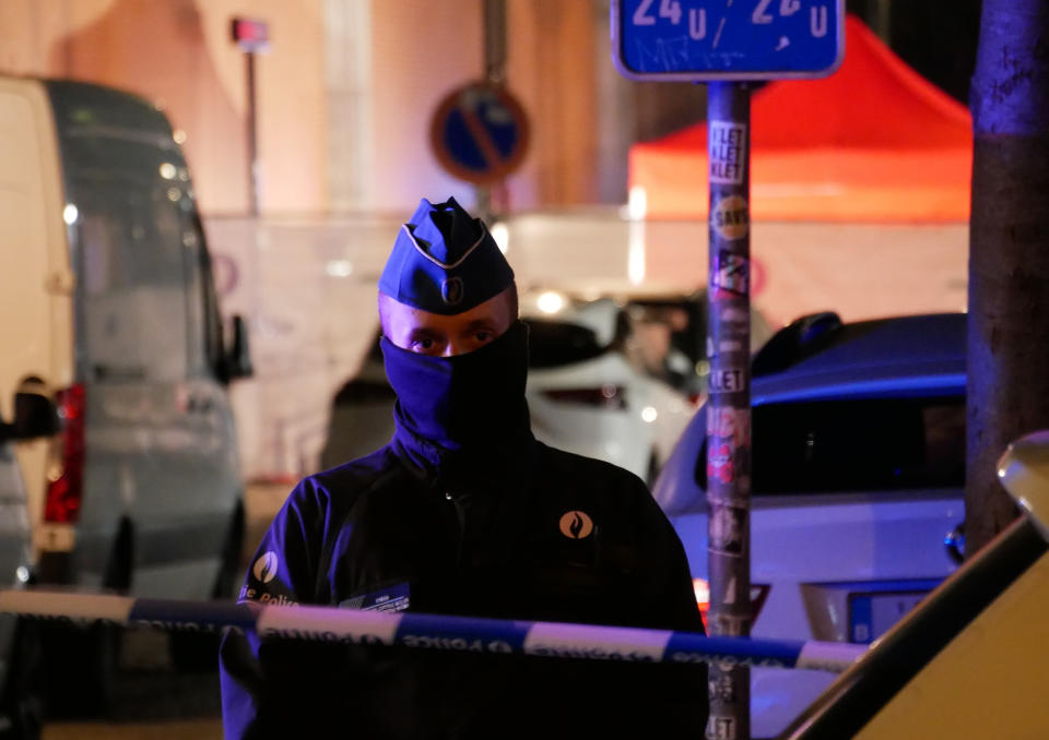 Police attend the scene of an incident in Brussels, Thursday Nov. 10, 2022. One police officer is dead and another injured in a stabbing attack in Brussels, which a Belgian judicial official says is suspected to be terrorism-linked. The suspected attacker was shot and “neutralized” after the stabbing Thursday evening, Belgian police said. (AP Photo/Sylvain Plazy)