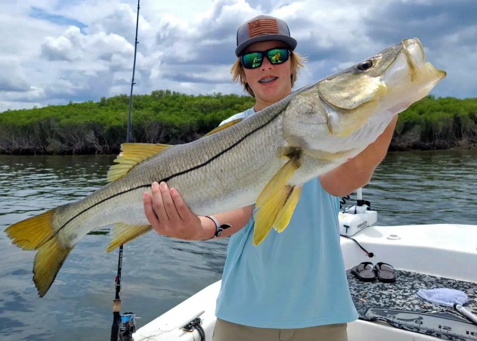 Rhett Bigham, 12, of Leesburg caught this 37-inch snook on a live mud minnow while fishing in Crystal River with Capt. Marrio Castello, of Tall Tales Charters on Wednesday.