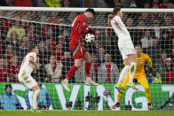Wales Kieffer Moore, centre, attempts a shot on goal during Euro 2024 soccer play-off match between Wales and Poland at Cardiff City Stadium, Wales, Tuesday, March 26, 2024. (AP Photo/Alastair Grant)