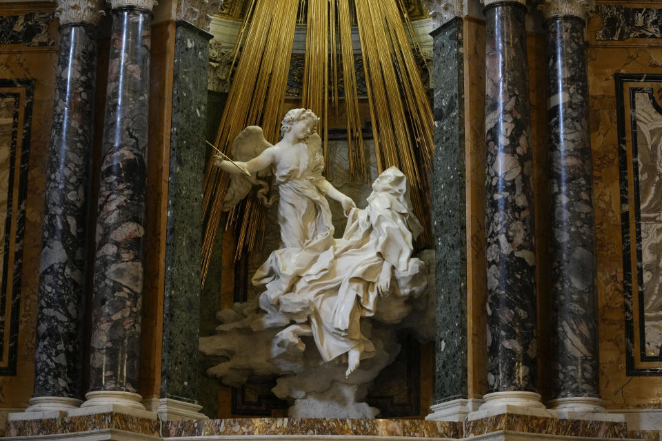 A view of the Ecstasy of Saint Teresa, the central sculptural marble group in the Cornaro Chapel during the presentation of its restoration in Santa Maria Della Vittoria Church, in Rome, Thursday, Oct. 21, 2021. The restoration involved the entire chapel, a masterpiece of the High Roman Baroque, designed and completed by Gian Lorenzo Bernini in 1653. (AP Photo/Alessandra Tarantino)