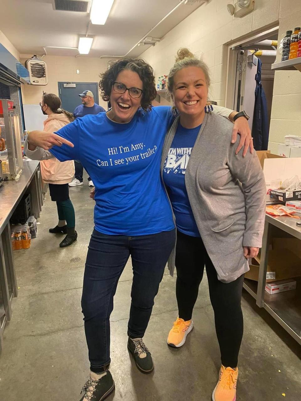 As they worked concessions at a Gardner Edgerton High football game, Amy Higgins sports the T-shirt Sheila Sloss gave her.