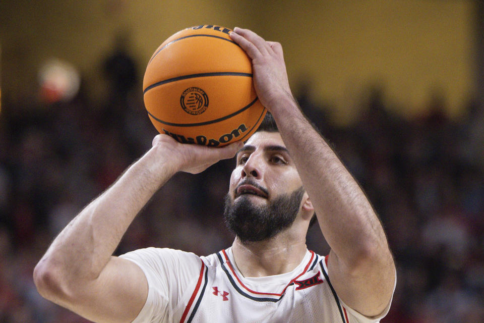 FILE - Fardaws Aimaq shoots a free throw during the second half of an NCAA college basketball game, Feb. 25, 2023, in Lubbock, Texas. California basketball coach Mark Madsen says Aimaq, now playing for Cal, was called “a terrorist” by a heckling fan after a game against UTEP this week in the SoCal Challenge. Aimaq's parents are Afghan refugees. Maden says Aimaq was allegedly subjected to abhorrent and offensive comments from a fan on Monday, Nov. 20, 2023. (AP Photo/Chase Seabolt, File)