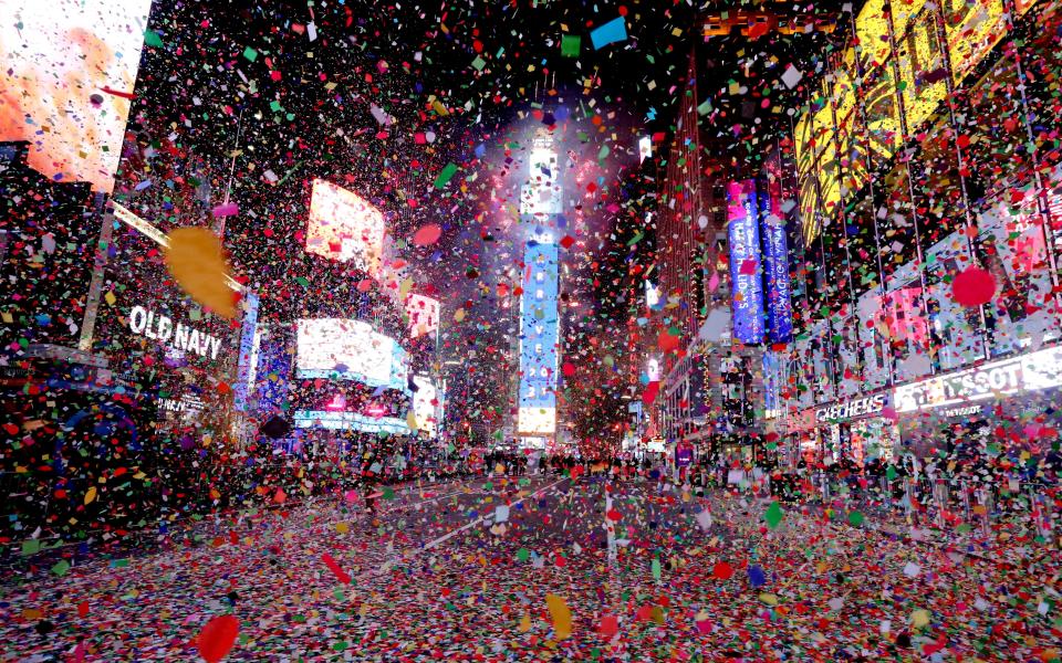 Confetti rains down on an empty Times Square in Manhattan after the ball dropped Jan. 1, marking the start of 2021. Times Square, usually packed with thousands, was closed to all but a few because of COVID-19 restrictions.