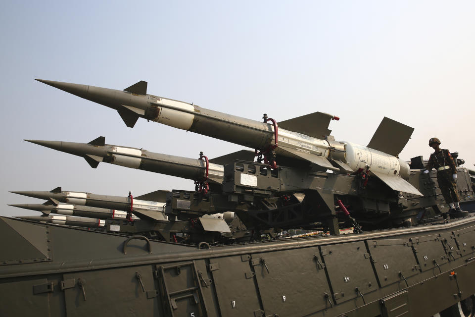 Military officers stand atop trucks loaded with missiles during a parade to commemorate Myanmar's 78th Armed Forces Day in Naypyitaw, Myanmar, Monday, March 27, 2023. (AP Photo/Aung Shine Oo)