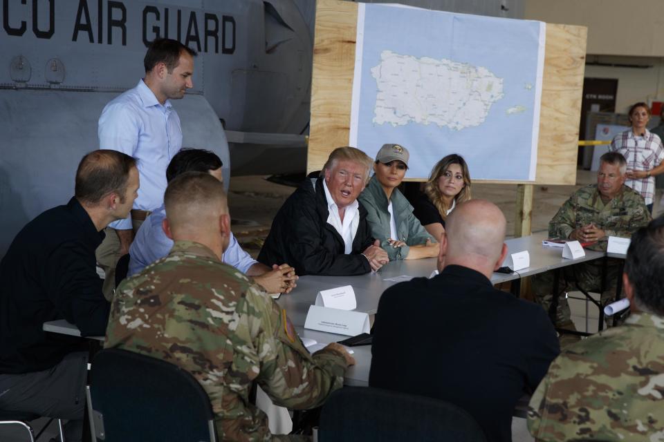 <p>President Donald Trump and first lady Melania Trump participate in a briefing on hurricane recovery efforts with first responders at Luis Muniz Air National Guard Base, Tuesday, Oct. 3, 2017, in San Juan, Puerto Rico. (Photo: Evan Vucci/AP) </p>