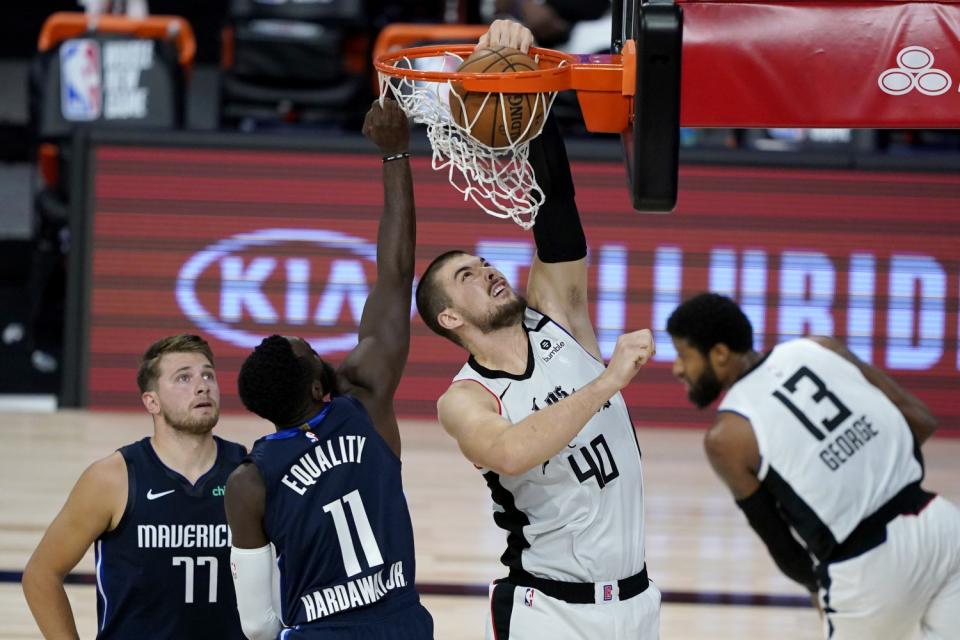 The Clippers' Ivica Zubac dunks on the Dallas Mavericks' Tim Hardaway Jr.