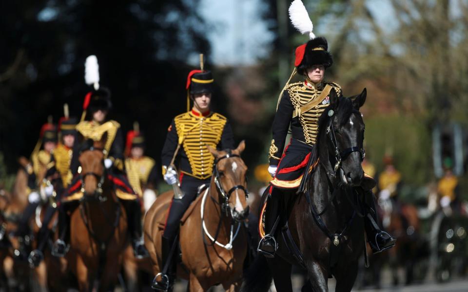 Members of The Kings Troop Royal Horse Artillery travel down the Long Walk up to Windsor Castle - Carl Recine/Reuters