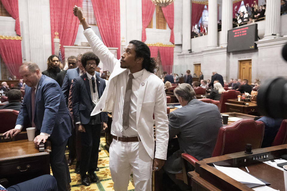 Jones raises his fist on the floor of the Tennessee House chamber after being expelled from the Legislature on April 6, 2023.