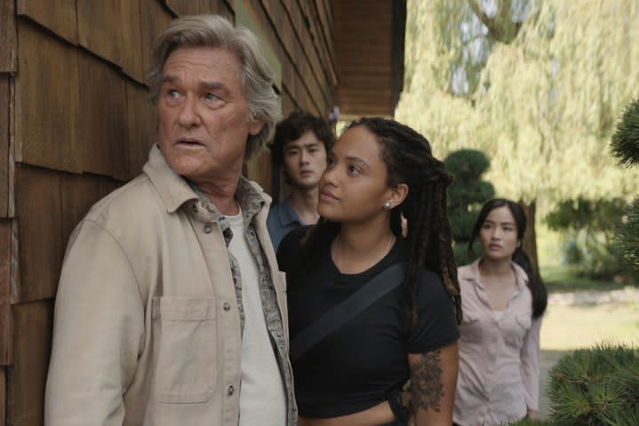 Kiersey Clemons looks at Kurt Russell in Monarch: Legacy of Monsters.