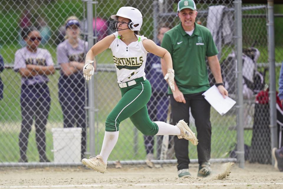 Smithfield's Skyla Oliveira races home with an insurance run during the bottom of the sixth inning in the Sentinels' 11-4 win over Bay View on Saturday.