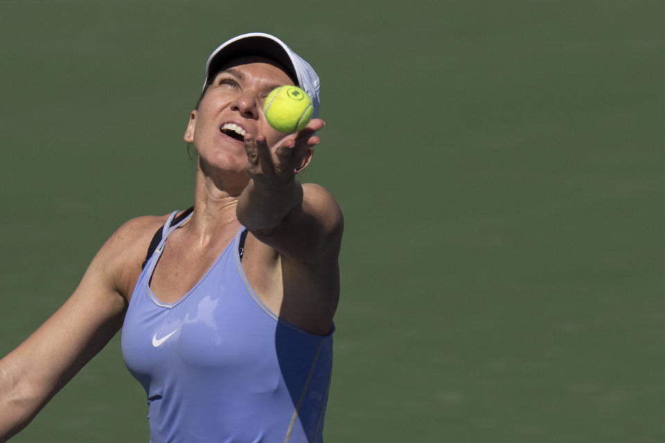 Simona Halep, of Romania, serves to Beatriz Haddad Maia, of Brazil, in the final of the National Bank Open tennis tournament in Toronto, Sunday, Aug. 14, 2022. (Chris Young/The Canadian Press via AP)