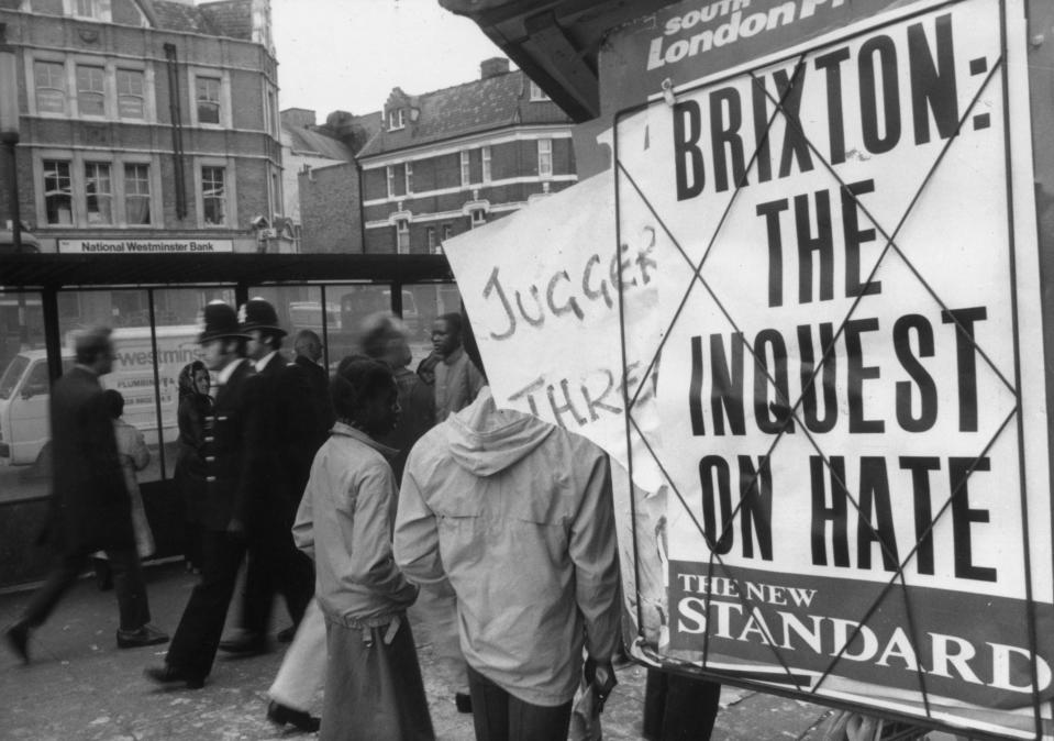 <p>Two policeman on the Brixton Road during the riots of 1981</p> (Getty Images)