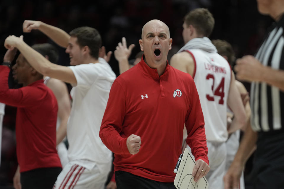 Utah head coach Craig Smith, center, reacts during the second half of an NCAA college basketball game against Washington State, Friday, Dec. 29, 2023, in Salt Lake City. (AP Photo/Rick Bowmer)