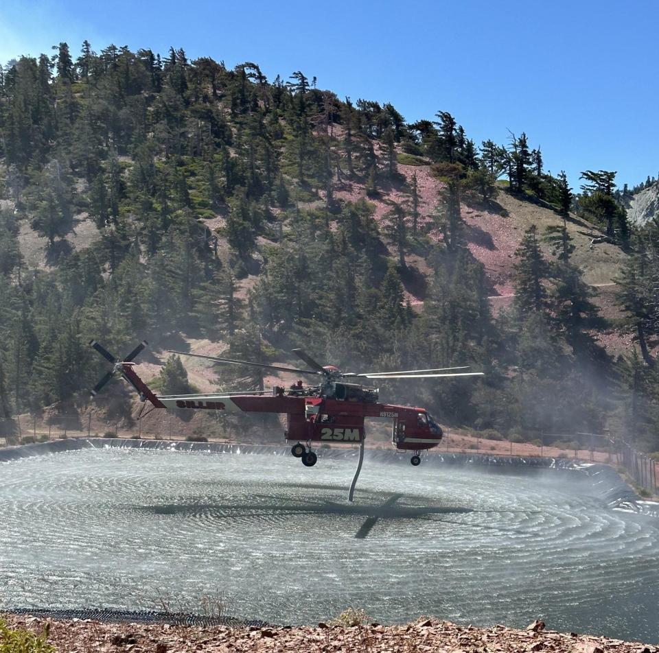 Firefighters work at the Vista Fire in the San Bernardino National Forest on Thursday, July 18, 2024.