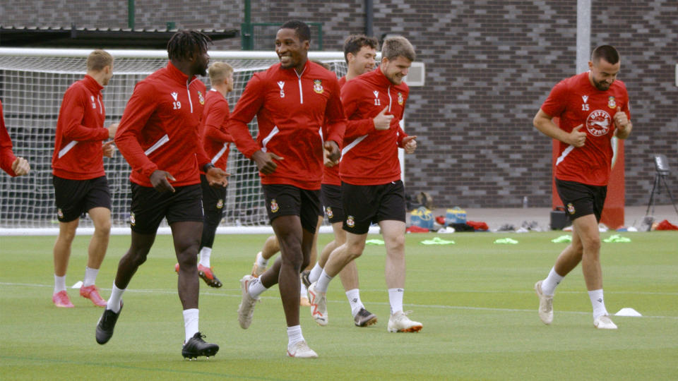 This image released by FX shows members of the Wrexham A.F.C. Bulldogs in a scene from the third season of "Welcome to Wrexham." (FX via AP)