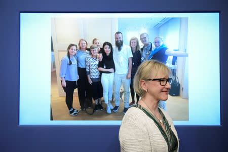 Swedish Foreign Minister Margot Wallstrom smiles in front of a picture of freed hostage Johan Gustafsson and his family at Arlanda airport after his arrival in Sweden on Monday, during a press conference at government headquarters in Stockholm, Sweden June 26, 2017. TT News Agency/Marcus Ericsson via REUTERS