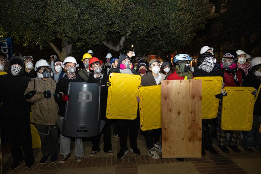 Los Angeles, CA - May 02: Demonstrators occupy a Pro-Palestinian encampment at UCLA as authorities breach and break up the encampment on Thursday, May 2, 2024 in Los Angeles, CA. (Jason Armond / Los Angeles Times)