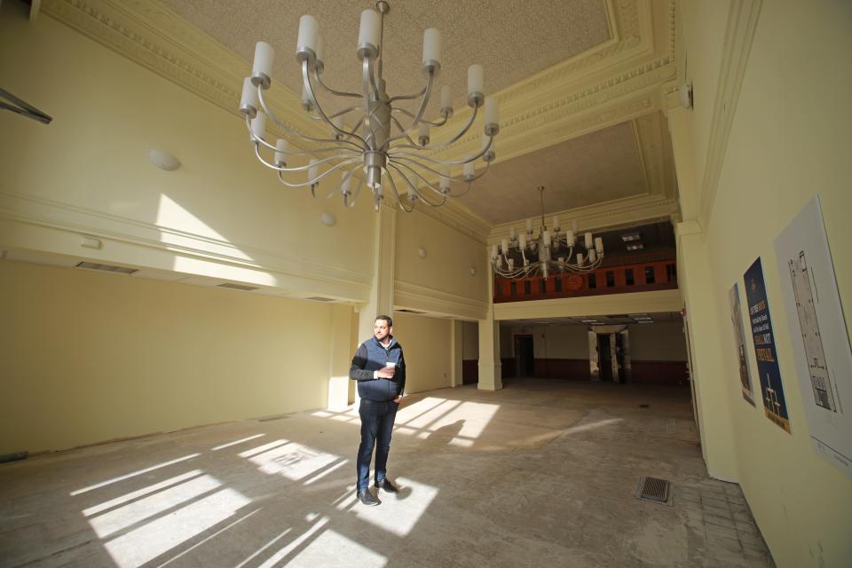 Aaron Baer stands in the lobby of Center For Christian Virtue new building. He said long-term plans for the building include having a coffee shop in this first-floor space.