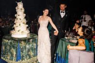 <p>The couple's six-layer cake was covered in flowers and created by Sylvia Weinstock for Ladurée, <a href="https://www.vogue.com/slideshow/jennifer-gates-nayel-nassar-wedding" rel="nofollow noopener" target="_blank" data-ylk="slk:Vogue reports;elm:context_link;itc:0;sec:content-canvas" class="link "><em>Vogue</em> reports</a>.</p>