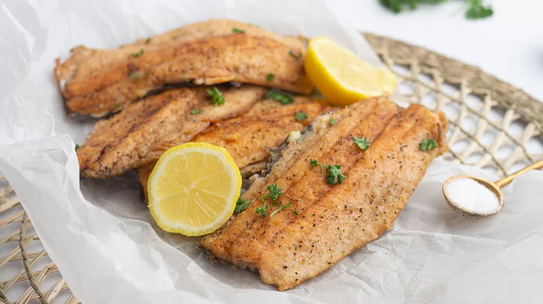 Fried fish fillets with lemon slices