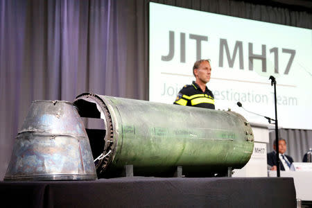 FILE PHOTO: A damaged missile is displayed during a news conference by members of the Joint Investigation Team, comprising the authorities from Australia, Belgium, Malaysia, the Netherlands and Ukraine who present interim results in the ongoing investigation of the 2014 MH17 crash that killed 298 people over eastern Ukraine, in Bunnik, Netherlands, May 24, 2018. REUTERS/Francois Lenoir/File Photo