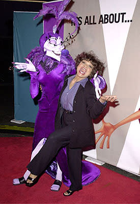 Yzma and Eartha Kitt share a laugh when the man in the poster behind them tries to cop a feel at the Hollywood premiere of Walt Disney's The Emperor's New Groove