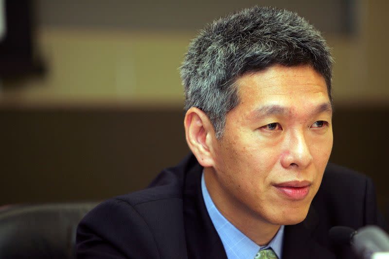 Lee Hsien Yang answers questions during a news conference in Singapore